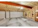 Spacious garage with concrete floors, overhead lighting, and walls ready for personalization at 6650 E Arizona Ave # 163, Denver, CO 80224