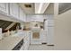 Modern white kitchen with stainless steel appliances, ample counter space, and a bright atmosphere at 6650 E Arizona Ave # 163, Denver, CO 80224
