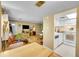 Open-concept living area with an adjacent kitchen featuring white appliances and plenty of counter space at 6650 E Arizona Ave # 163, Denver, CO 80224