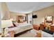 Comfortable main bedroom with a floral-themed comforter set and ample natural light, perfect for relaxation at 6650 E Arizona Ave # 163, Denver, CO 80224