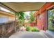 Covered patio overlooking a landscaped yard with trees and garden beds at 4465 Cody St, Wheat Ridge, CO 80033