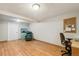 Finished basement with hardwood floors, TV, and comfortable seating at 11228 W 18Th Ave, Lakewood, CO 80215