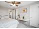 This bedroom features a ceiling fan, bright lighting and white trim at 11228 W 18Th Ave, Lakewood, CO 80215