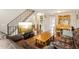 Comfortable living space boasting an open layout with a sofa, dining area, and staircase for modern living at 11228 W 18Th Ave, Lakewood, CO 80215