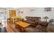 Cozy living space features a dining table, leather sofa, and a comfortable layout perfect for relaxation at 11228 W 18Th Ave, Lakewood, CO 80215