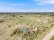 Aerial view of a home with backyard features, including a trampoline, and outbuildings at 1559 Lisbon Dr, Parker, CO 80138