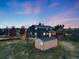 Aerial view of a sprawling property with a large home, outbuilding, and expansive grassy yard at 1559 Lisbon Dr, Parker, CO 80138