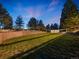 Expansive backyard with a brick retaining wall, well-maintained lawn, and ample space for recreation at 1559 Lisbon Dr, Parker, CO 80138