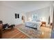 Cozy bedroom with hardwood floors, a comfortable queen-size bed, and natural light at 1559 Lisbon Dr, Parker, CO 80138