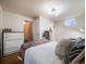 Bedroom with white bedding, a dresser, and a window offering outdoor views at 1559 Lisbon Dr, Parker, CO 80138