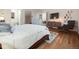 Comfortable bedroom with hardwood floors, a queen-size bed, and a serene atmosphere at 1559 Lisbon Dr, Parker, CO 80138