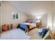 Bedroom featuring white walls, hardwood floors, a cozy bed and an abundance of natural light at 1559 Lisbon Dr, Parker, CO 80138