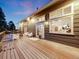 Wide angle shot of an outdoor deck featuring seating, a fire pit, string lights, and views of the surrounding scenery at 1559 Lisbon Dr, Parker, CO 80138
