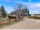 A side exterior view of the house, wooden deck, patio, and beautiful countryside at 1559 Lisbon Dr, Parker, CO 80138