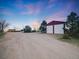 Spacious detached garage with multiple bays, a long driveway, and ample parking space at 1559 Lisbon Dr, Parker, CO 80138