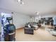 Expansive living room with home exercise equipment and access to a patio area at 1559 Lisbon Dr, Parker, CO 80138