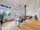 Inviting living room and dining area with hardwood floors, large windows, and a cozy atmosphere at 1559 Lisbon Dr, Parker, CO 80138