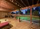 Covered patio with wood beam ceiling and outdoor furniture, ideal for entertaining and relaxing outdoors at 1559 Lisbon Dr, Parker, CO 80138
