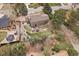 Aerial view showcases this two-story home with manicured backyard, beautiful landscaping, and outdoor trampoline at 8015 Lt William Clark Rd, Parker, CO 80134