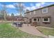 Expansive backyard featuring a dining table beneath a pergola, perfect for outdoor entertaining and relaxation at 8015 Lt William Clark Rd, Parker, CO 80134