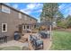 Spacious backyard includes a deck, outdoor seating, manicured lawn, and well-maintained landscaping at 8015 Lt William Clark Rd, Parker, CO 80134