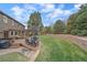 Inviting backyard featuring a spacious deck with an outdoor dining area, lush lawn, and professional landscaping at 8015 Lt William Clark Rd, Parker, CO 80134