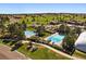 Community pool showcasing a recreational space featuring swimming pools, a water slide, and a golf course in the background at 8015 Lt William Clark Rd, Parker, CO 80134