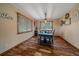 Cozy dining room featuring hardwood floors, a stylish table, and natural light at 8015 Lt William Clark Rd, Parker, CO 80134