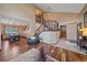 Open concept foyer showcases hardwood floors, a staircase, and seamless transition to dining area at 8015 Lt William Clark Rd, Parker, CO 80134
