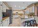Bright and spacious kitchen with stainless steel appliances and granite countertops at 8015 Lt William Clark Rd, Parker, CO 80134