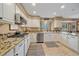 Clean kitchen with granite countertops, stainless steel appliances, and ample cabinet space at 8015 Lt William Clark Rd, Parker, CO 80134