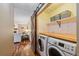 Convenient laundry room featuring a sliding barn door, washer, and dryer at 8015 Lt William Clark Rd, Parker, CO 80134