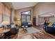 Bright living room with hardwood floors, stylish furnishings, and large windows at 8015 Lt William Clark Rd, Parker, CO 80134