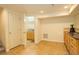 Finished basement area with tile flooring, wet bar and adjacent bathroom at 709 S Depew St, Lakewood, CO 80226