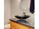 Stylish bathroom vanity with modern vessel sink and granite countertop at 709 S Depew St, Lakewood, CO 80226