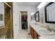 Bathroom features dual sinks, granite countertops, and a glass-enclosed shower at 709 S Depew St, Lakewood, CO 80226
