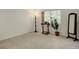 The well-lit carpeted bedroom boasts a window and neutral decor at 709 S Depew St, Lakewood, CO 80226