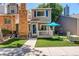 Charming exterior of a two-story home with a brick chimney and cozy front porch at 709 S Depew St, Lakewood, CO 80226