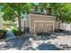 Attached two-car garage and landscaping of the townhome with garage door at 709 S Depew St, Lakewood, CO 80226