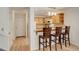 Charming kitchen featuring wooden cabinets and breakfast bar with seating at 709 S Depew St, Lakewood, CO 80226