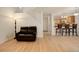 Open-concept living room with a view of the kitchen and breakfast bar at 709 S Depew St, Lakewood, CO 80226