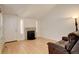 Inviting living room with hardwood floors, brick fireplace, and comfortable seating at 709 S Depew St, Lakewood, CO 80226
