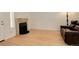 Spacious living room with a fireplace and a comfortable leather sofa at 709 S Depew St, Lakewood, CO 80226