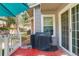Cozy porch featuring a barbecue grill, seating, and views of the backyard at 709 S Depew St, Lakewood, CO 80226