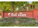 Community entrance sign for Oak Run, surrounded by lush greenery at 709 S Depew St, Lakewood, CO 80226