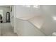 Bright upstairs stairway with neutral carpet and plenty of light at 709 S Depew St, Lakewood, CO 80226