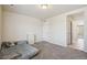 Well-lit bedroom featuring a dresser, plush carpet, and closet, offering ample space for relaxation and storage at 19471 W 59Th Ave, Golden, CO 80403