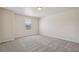 Neutral bedroom with plush carpet and a large window providing natural light to create a relaxing space at 19471 W 59Th Ave, Golden, CO 80403