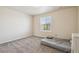 Neutral bedroom featuring plush carpet, a bright window and an ensuite at 19471 W 59Th Ave, Golden, CO 80403