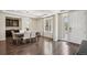 Elegant dining room features modern light fixture, dark hardwood floors, and bright window at 19471 W 59Th Ave, Golden, CO 80403